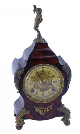 A 19thC painted cartel style mantel clock with gilt brass mounts and cherub finial