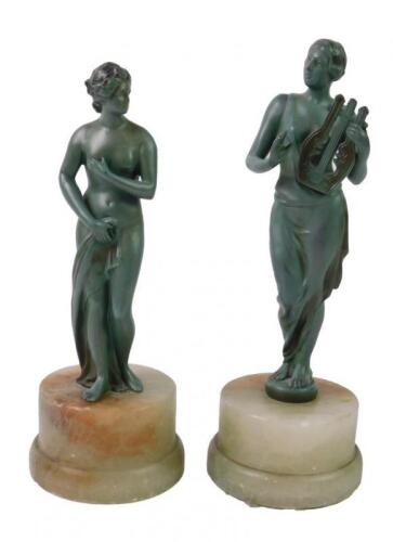 A pair of cast metal figures modelled as Venus and Erato