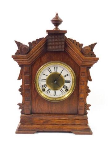 An American late 19thC oak cased mantel clock