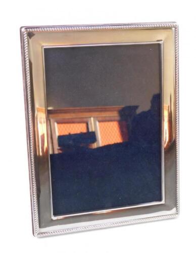 A silver rectangular framed strut photograph frame