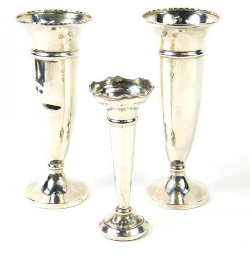 A pair of George VI loaded silver bud vases