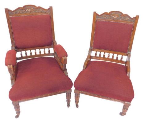 A pair of Victorian gentleman and lady's mahogany armchairs