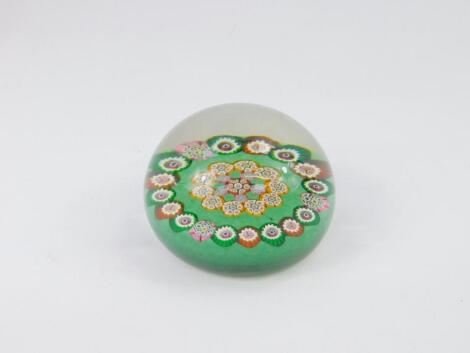 A Monart glass millefiori paperweight