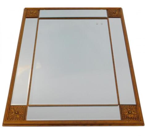 A gilt plaster rectangular wall mirror