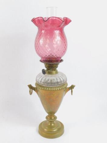 A brass twin handled oil lamp