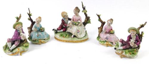 A Capodimonte porcelain figure group modelled as a boy and girl seated against a tree