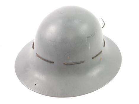 A WWII grey tin helmet