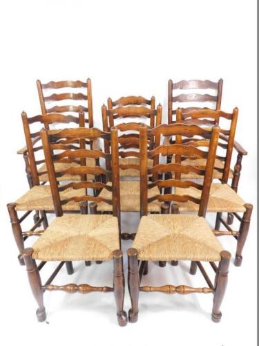 A set of eight 18thC oak ladder back dining chairs