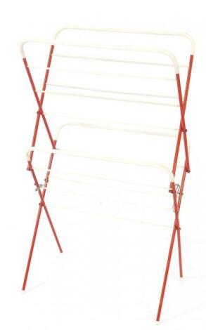 A vintage 20thC red metal and white plastic clothes airer. 110cm H