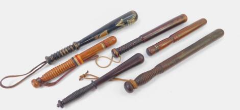 A group of six wooden truncheons