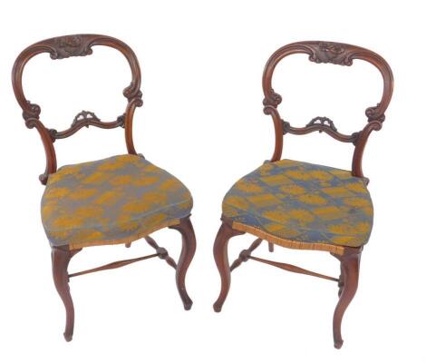 A pair of Victorian mahogany balloon back salon chairs