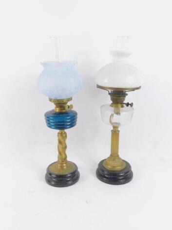 A duplex brass oil lamp