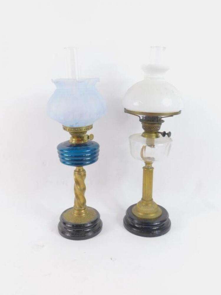 A duplex brass oil lamp
