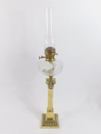 A brass Corinthian column oil lamp