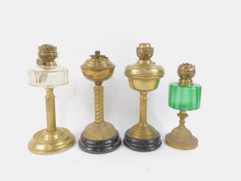 Four brass oil lamps