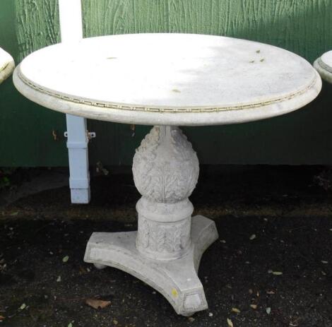 A faux marble circular garden table