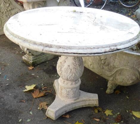 A faux marble circular garden table