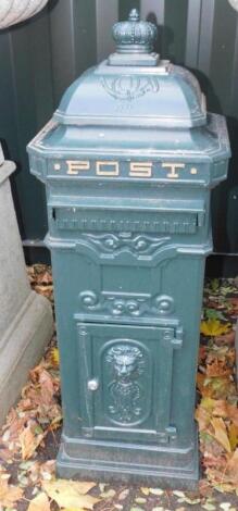 A green painted metal Continental style post box