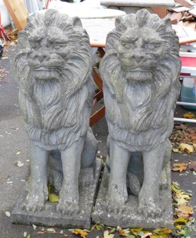 A pair of faux marble garden lions