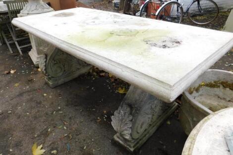 A faux marble rectangular garden table