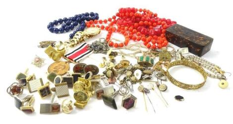 A quantity of modern costume jewellery and badges