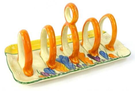 A Clarice Cliff Crocus pattern four division toast rack