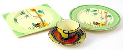 A Clarice Cliff Bizarre Tennis pattern tapering cup and saucer