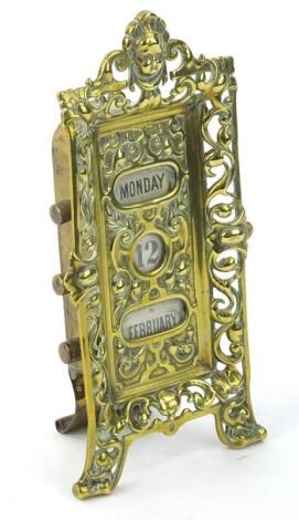 An Edwardian brass desk calendar