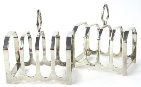 A pair of George VI silver four division toast racks