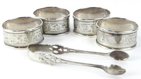 A set of four silver napkin rings