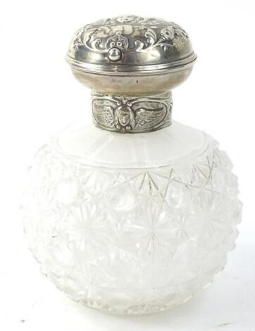 An Edwardian cut glass scent bottle