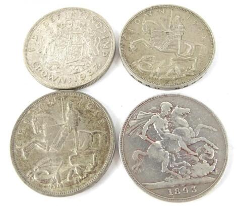 A collection of four silver crowns