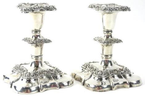 A pair of Victorian dwarf silver plated candlesticks