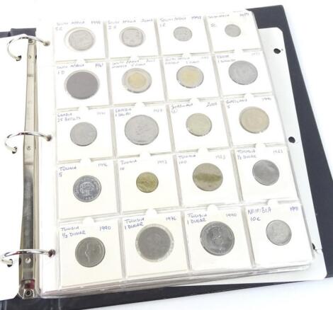 An album containing various foreign coins