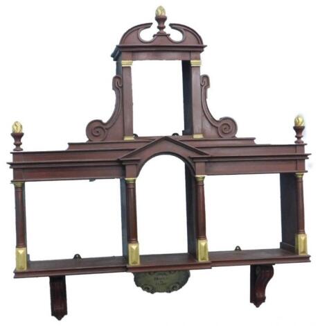 An ornate painted and partial gilt wall display stand