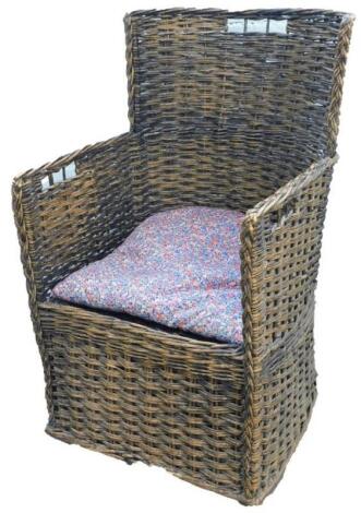 A 19thC/early 20thC rattan basket weave arm chair