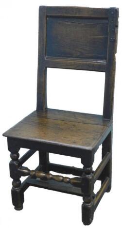 An early 17thC oak chair or back stool