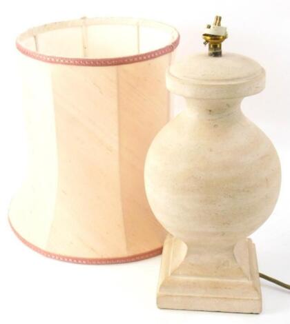 A classical design table lamp in polished stone