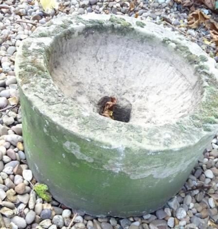 A circular stone hewn trough or sink