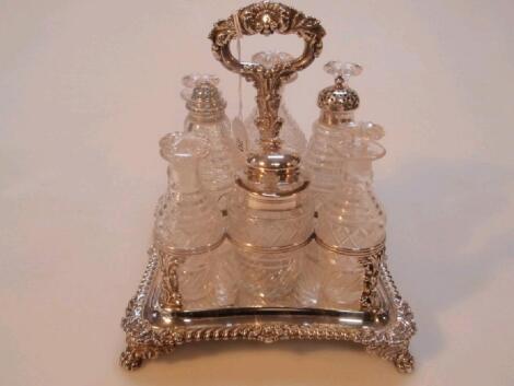 A George V silver eight bottle cruet set