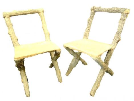 An unusual pair of continental composition stone French grotto type chairs