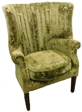 A mahogany wing back chair in George III style