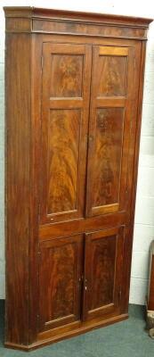 An early 19thC mahogany standing corner cabinet