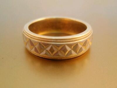 A bi-colour 18ct gold wedding band