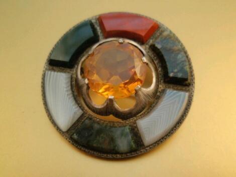 A Scottish agate and citrine set circular brooch set in white metal