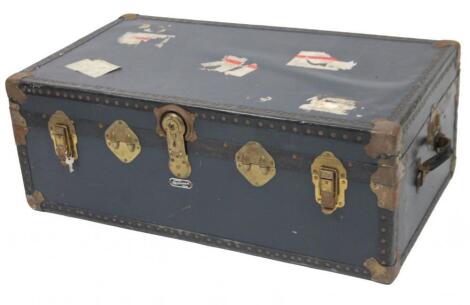 A 20thC pressed leather Mossman travel trunk