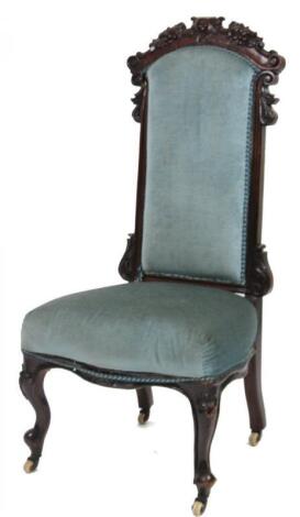 A mid 19thC walnut nursing chair