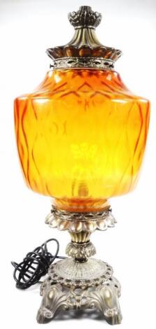 A 20thC amber glass lamp