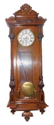 A late 19thC walnut cased Vienna wall clock