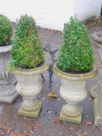 A pair of concrete Neo Classical garden urns